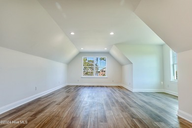 Step into paradise at 115 Genoes Point Road SW, where coastal on Lockwood Folly Country Club in North Carolina - for sale on GolfHomes.com, golf home, golf lot