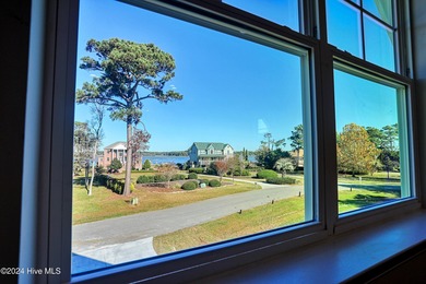 Step into paradise at 115 Genoes Point Road SW, where coastal on Lockwood Folly Country Club in North Carolina - for sale on GolfHomes.com, golf home, golf lot