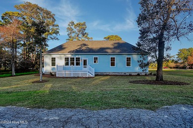Step into paradise at 115 Genoes Point Road SW, where coastal on Lockwood Folly Country Club in North Carolina - for sale on GolfHomes.com, golf home, golf lot