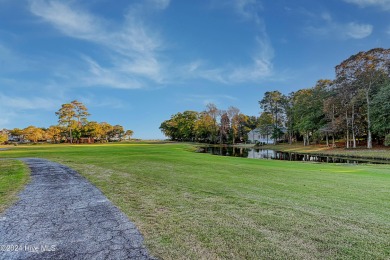 Step into paradise at 115 Genoes Point Road SW, where coastal on Lockwood Folly Country Club in North Carolina - for sale on GolfHomes.com, golf home, golf lot