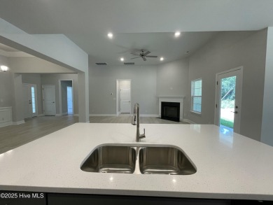 Check out this beautiful new construction home built by ADAMS on Carolina National Golf Club in North Carolina - for sale on GolfHomes.com, golf home, golf lot