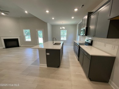 Check out this beautiful new construction home built by ADAMS on Carolina National Golf Club in North Carolina - for sale on GolfHomes.com, golf home, golf lot