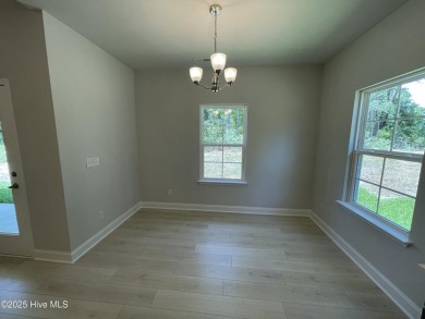 Check out this beautiful new construction home built by ADAMS on Carolina National Golf Club in North Carolina - for sale on GolfHomes.com, golf home, golf lot