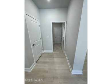 Check out this beautiful new construction home built by ADAMS on Carolina National Golf Club in North Carolina - for sale on GolfHomes.com, golf home, golf lot