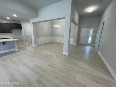 Check out this beautiful new construction home built by ADAMS on Carolina National Golf Club in North Carolina - for sale on GolfHomes.com, golf home, golf lot