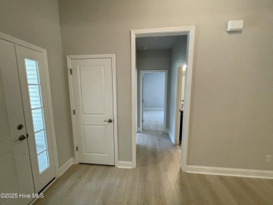 Check out this beautiful new construction home built by ADAMS on Carolina National Golf Club in North Carolina - for sale on GolfHomes.com, golf home, golf lot