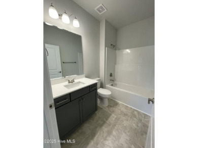 Check out this beautiful new construction home built by ADAMS on Carolina National Golf Club in North Carolina - for sale on GolfHomes.com, golf home, golf lot