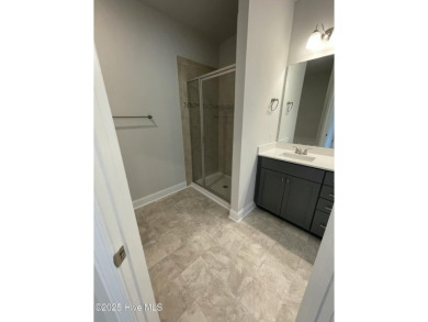 Check out this beautiful new construction home built by ADAMS on Carolina National Golf Club in North Carolina - for sale on GolfHomes.com, golf home, golf lot