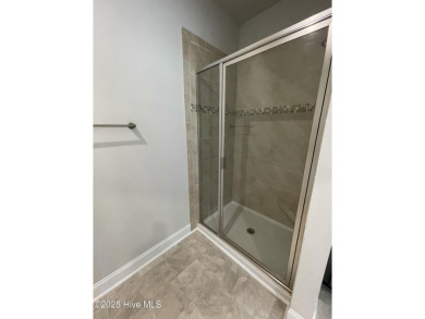 Check out this beautiful new construction home built by ADAMS on Carolina National Golf Club in North Carolina - for sale on GolfHomes.com, golf home, golf lot