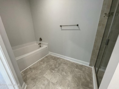 Check out this beautiful new construction home built by ADAMS on Carolina National Golf Club in North Carolina - for sale on GolfHomes.com, golf home, golf lot