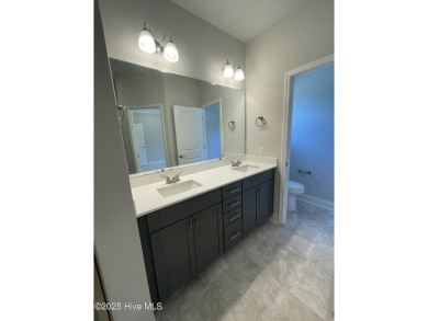 Check out this beautiful new construction home built by ADAMS on Carolina National Golf Club in North Carolina - for sale on GolfHomes.com, golf home, golf lot