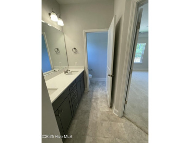 Check out this beautiful new construction home built by ADAMS on Carolina National Golf Club in North Carolina - for sale on GolfHomes.com, golf home, golf lot