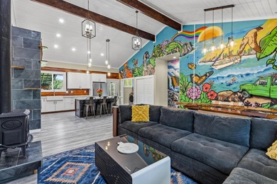 Lovingly built, this newer 3-bedroom, 2-bath custom home is on Volcano Golf and Country Club in Hawaii - for sale on GolfHomes.com, golf home, golf lot