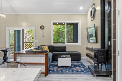 Lovingly built, this newer 3-bedroom, 2-bath custom home is on Volcano Golf and Country Club in Hawaii - for sale on GolfHomes.com, golf home, golf lot