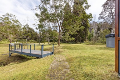 Lovingly built, this newer 3-bedroom, 2-bath custom home is on Volcano Golf and Country Club in Hawaii - for sale on GolfHomes.com, golf home, golf lot