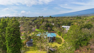 Lovingly built, this newer 3-bedroom, 2-bath custom home is on Volcano Golf and Country Club in Hawaii - for sale on GolfHomes.com, golf home, golf lot