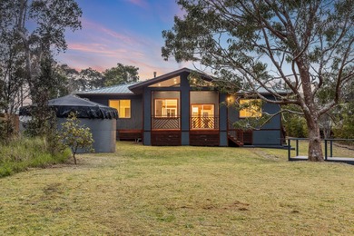 Lovingly built, this newer 3-bedroom, 2-bath custom home is on Volcano Golf and Country Club in Hawaii - for sale on GolfHomes.com, golf home, golf lot