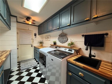 Charming Lakefront Home with Boat Dock & Stunning Sunsets
 on Lions Den Golf Club in Arkansas - for sale on GolfHomes.com, golf home, golf lot