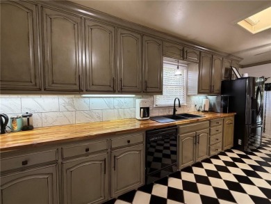 Charming Lakefront Home with Boat Dock & Stunning Sunsets
 on Lions Den Golf Club in Arkansas - for sale on GolfHomes.com, golf home, golf lot