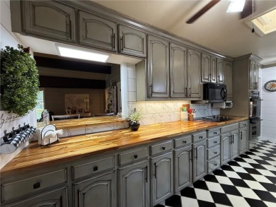 Charming Lakefront Home with Boat Dock & Stunning Sunsets
 on Lions Den Golf Club in Arkansas - for sale on GolfHomes.com, golf home, golf lot