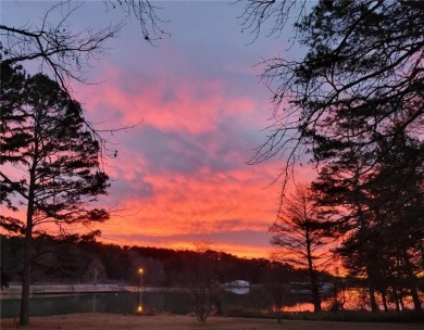 Charming Lakefront Home with Boat Dock & Stunning Sunsets
 on Lions Den Golf Club in Arkansas - for sale on GolfHomes.com, golf home, golf lot