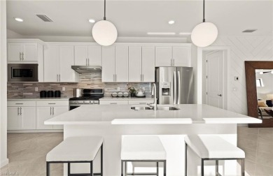This stunning Hallmark Home Plan offers three spacious bedrooms on Valencia Golf and Country Club in Florida - for sale on GolfHomes.com, golf home, golf lot