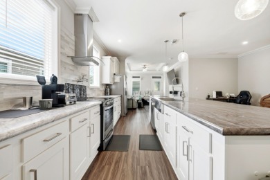 Welcome home to this beautifully maintained Breezeway Cottage on Water Oak Country Club Estates in Florida - for sale on GolfHomes.com, golf home, golf lot