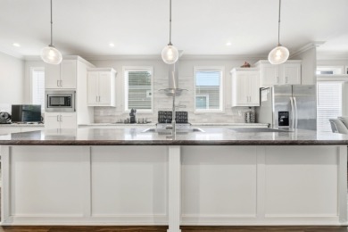 Welcome home to this beautifully maintained Breezeway Cottage on Water Oak Country Club Estates in Florida - for sale on GolfHomes.com, golf home, golf lot