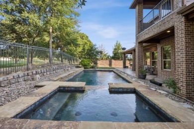 Stunning former model home perfectly positioned on the 13th hole on Lantana Golf Club in Texas - for sale on GolfHomes.com, golf home, golf lot