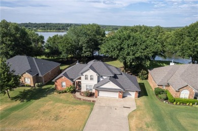 Enjoy this lakefront home in all seasons! Fish off the dock and on Vache-Grasse Country Club in Arkansas - for sale on GolfHomes.com, golf home, golf lot