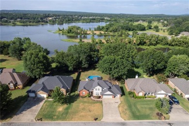 Enjoy this lakefront home in all seasons! Fish off the dock and on Vache-Grasse Country Club in Arkansas - for sale on GolfHomes.com, golf home, golf lot