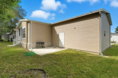 Welcome home to this beautifully maintained Breezeway Cottage on Water Oak Country Club Estates in Florida - for sale on GolfHomes.com, golf home, golf lot