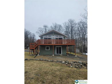 Great opportunity to own a fully updated raised chalet in the on Pocono Farms Country Club in Pennsylvania - for sale on GolfHomes.com, golf home, golf lot