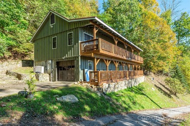Offered FULLY FURNISHED, this stunning mountain retreat sits at on Wolf Laurel Country Club in North Carolina - for sale on GolfHomes.com, golf home, golf lot