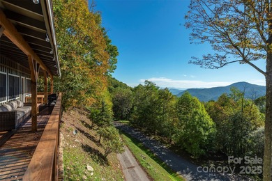 Offered FULLY FURNISHED, this stunning mountain retreat sits at on Wolf Laurel Country Club in North Carolina - for sale on GolfHomes.com, golf home, golf lot