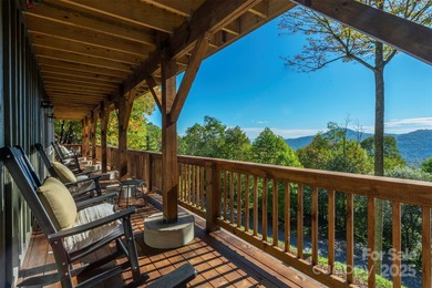 Offered FULLY FURNISHED, this stunning mountain retreat sits at on Wolf Laurel Country Club in North Carolina - for sale on GolfHomes.com, golf home, golf lot