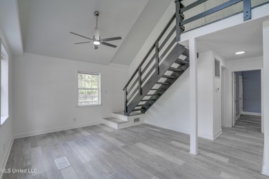 This beautifully updated and recently renovated 3-bedroom on Diamondhead Country Club in Mississippi - for sale on GolfHomes.com, golf home, golf lot