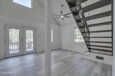This beautifully updated and recently renovated 3-bedroom on Diamondhead Country Club in Mississippi - for sale on GolfHomes.com, golf home, golf lot