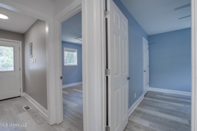 This beautifully updated and recently renovated 3-bedroom on Diamondhead Country Club in Mississippi - for sale on GolfHomes.com, golf home, golf lot
