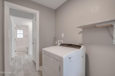 This beautifully updated and recently renovated 3-bedroom on Diamondhead Country Club in Mississippi - for sale on GolfHomes.com, golf home, golf lot