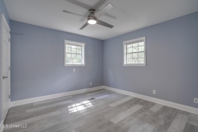 This beautifully updated and recently renovated 3-bedroom on Diamondhead Country Club in Mississippi - for sale on GolfHomes.com, golf home, golf lot