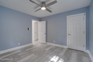 This beautifully updated and recently renovated 3-bedroom on Diamondhead Country Club in Mississippi - for sale on GolfHomes.com, golf home, golf lot