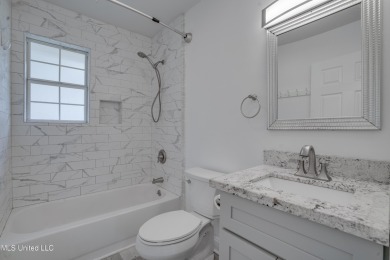 This beautifully updated and recently renovated 3-bedroom on Diamondhead Country Club in Mississippi - for sale on GolfHomes.com, golf home, golf lot