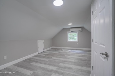 This beautifully updated and recently renovated 3-bedroom on Diamondhead Country Club in Mississippi - for sale on GolfHomes.com, golf home, golf lot