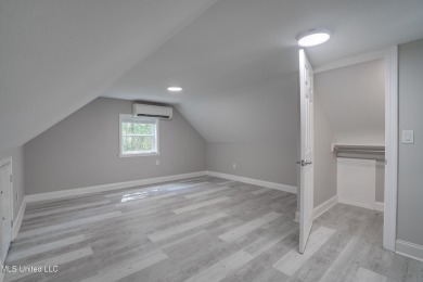 This beautifully updated and recently renovated 3-bedroom on Diamondhead Country Club in Mississippi - for sale on GolfHomes.com, golf home, golf lot