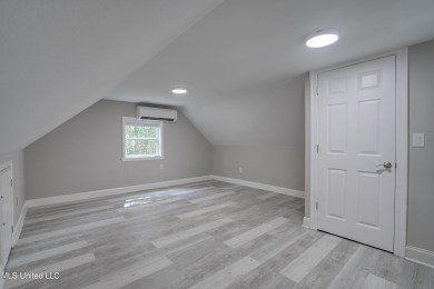 This beautifully updated and recently renovated 3-bedroom on Diamondhead Country Club in Mississippi - for sale on GolfHomes.com, golf home, golf lot