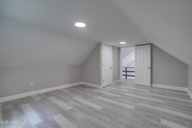 This beautifully updated and recently renovated 3-bedroom on Diamondhead Country Club in Mississippi - for sale on GolfHomes.com, golf home, golf lot