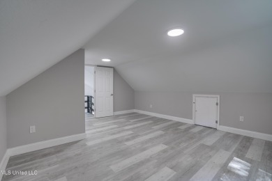 This beautifully updated and recently renovated 3-bedroom on Diamondhead Country Club in Mississippi - for sale on GolfHomes.com, golf home, golf lot