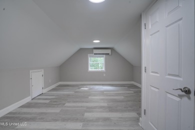 This beautifully updated and recently renovated 3-bedroom on Diamondhead Country Club in Mississippi - for sale on GolfHomes.com, golf home, golf lot