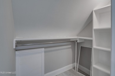 This beautifully updated and recently renovated 3-bedroom on Diamondhead Country Club in Mississippi - for sale on GolfHomes.com, golf home, golf lot